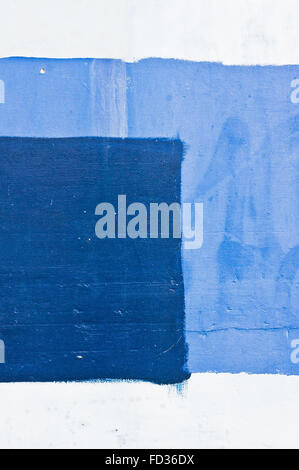 Shades of blue and white paint on a stone wall Stock Photo
