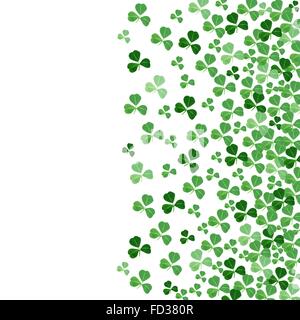 St Patricks Day border or background of green shamrocks over white Stock Photo