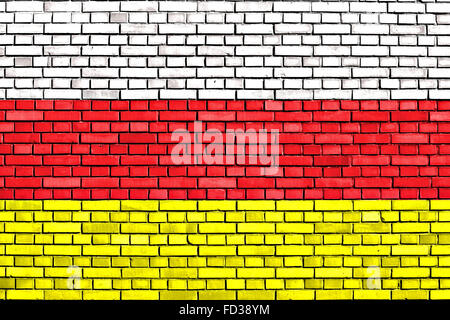 flag of North Ossetia painted on brick wall Stock Photo