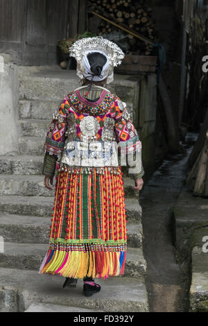 Short Skirt Miao woman, rear view, Datang Village, Guizhou Province, China Stock Photo