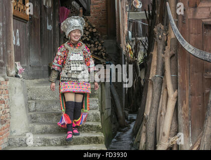 Short Skirt Miao woman in traditional attire, Datang Village, Guizhou Province, China Stock Photo