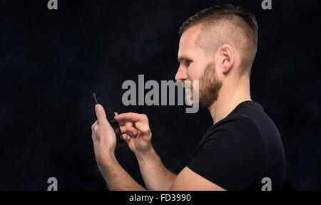 Man using smartphone or tablet pc. Stock Photo