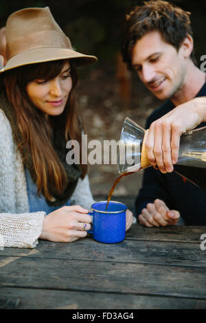 A young couple on an adventure camping in Big Sur, California. Stock Photo