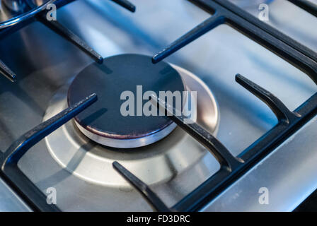 Metallic kitchen stove burner and black square frame. Stock Photo