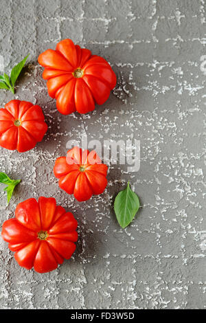 tomatoes on cement background, food Stock Photo