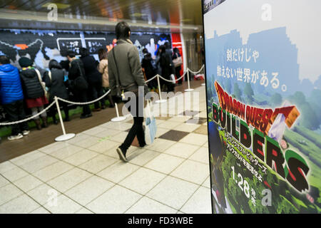 Dragon Quest fans collect blocks from a giant Lego wall mural on January 28, 2016 in Tokyo, Japan. The mural is part of a promotion in Shinjuku Station to celebrate the release of new game Dragon Quest Builders. The 80 meter mural was made with 180,000 Lego blocks and fans were allowed to remove blocks to reveal a secret poster behind. Some blocks contained QR codes allowing fans to access exclusive content. © Rodrigo Reyes Marin/AFLO/Alamy Live News Stock Photo