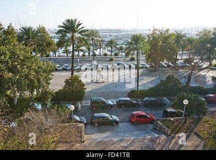 Cars parked and maritime sculpture on Paseo Maritimo on a sunny day in December with blue sky in December in Palma de Mallorca Stock Photo