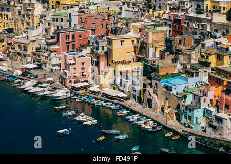 A view of the bright houses and boats of the town and marina of Corricella, on the island of Procida. Stock Photo