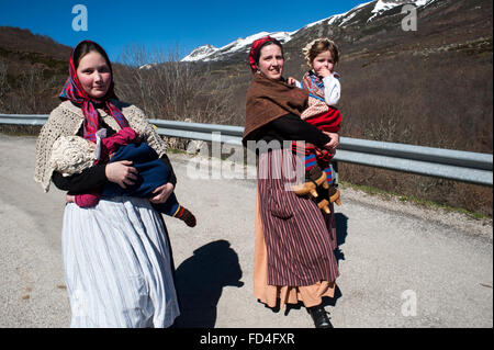 Two young couples with their children participating in the carnival zamarrones Polaciones with typical costumes of the valley Stock Photo