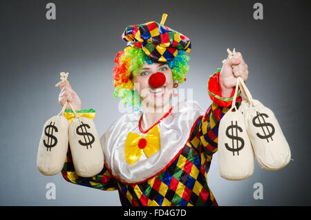 The funny clown in comical concept Stock Photo