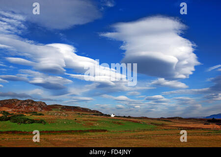 Lenticular clouds hovering over the rural countryside near Kintra on the Isle of Mull in Scotland Stock Photo