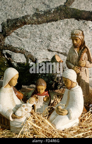 Christmas crib in a caholic church. Nativity scene. The holy Family. Stock Photo