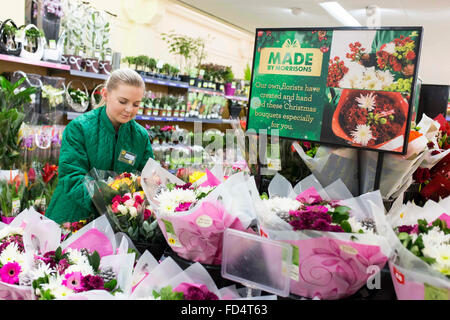 Morrisons supermarket. A woman working in the florist section Stock Photo