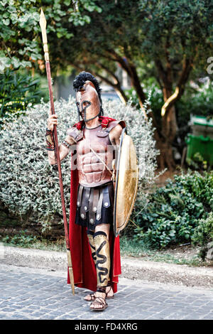 A man in costume of an ancient Greek warrior in the streets of Athens, Greece Stock Photo