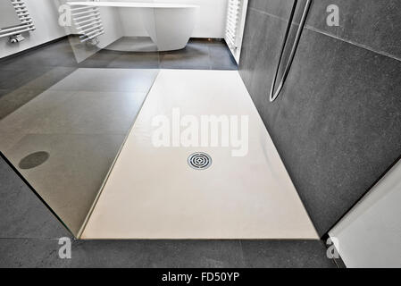 Corian floor and drain from modern shower in luxury bathroom Stock Photo