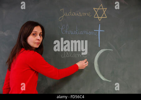 School teacher explaining religions. Stock Photo