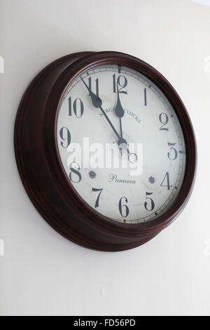 Old wooden clock on wall Stock Photo