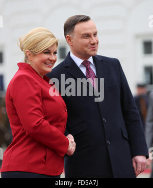 Warsaw, Poland. 28th Jan, 2016. Croatian President, Kolinda Grabar-Kitarovic and Polish President Andrzej Duda shake hands during the official welcoming ceremony of the Croatian President to the Presidential Palace in Warsaw. Croatian President, Kolinda Grabar-Kitarovic met with Polish President Andrzej Duda in the Presidential Palace in Poland's capital, Warsaw during her official visit to Poland. Credit:  PACIFIC PRESS/Alamy Live News Stock Photo