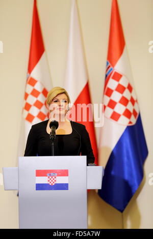 Warsaw, Poland. 28th Jan, 2016. Croatian President, Kolinda Grabar-Kitarovic listens to a translation of Polish President Andrzej Duda's remarks during a press conference during the Croatian President's visit to Warsaw. Croatian President, Kolinda Grabar-Kitarovic met with Polish President Andrzej Duda in the Presidential Palace in Poland's capital, Warsaw during her official visit to Poland. Credit:  PACIFIC PRESS/Alamy Live News Stock Photo