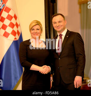 Warsaw, Poland. 28th Jan, 2016. Croatian President, Kolinda Grabar-Kitarovic and Polish President Andrzej Duda shakes hands following a press conference in the Presidential Palace in Warsaw. Croatian President, Kolinda Grabar-Kitarovic met with Polish President Andrzej Duda in the Presidential Palace in Poland's capital, Warsaw during her official visit to Poland. Credit:  PACIFIC PRESS/Alamy Live News Stock Photo