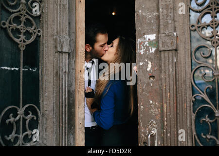 man and woman posing in door Stock Photo