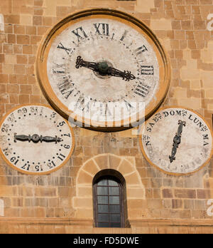 three clocks telling time,day and month calendar on saint johns church,  Valletta Malta Stock Photo