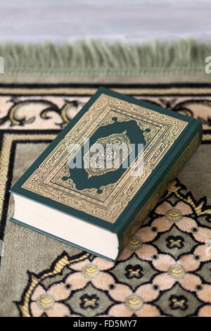 Holy Koran book on a carpet Stock Photo