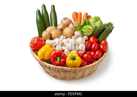 Basket with fresh vegetables on white background Stock Photo