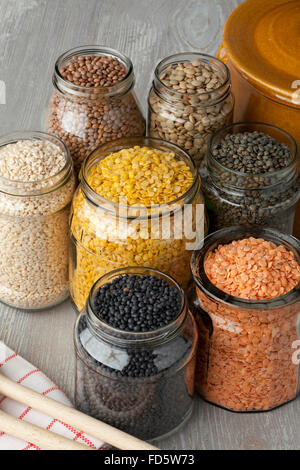 Variety of dried lentils in glass pots Stock Photo