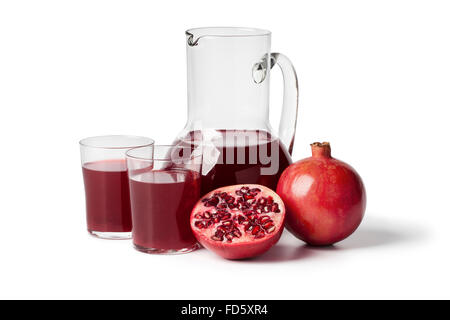 Fresh pomegranate juice in a jar on white background Stock Photo