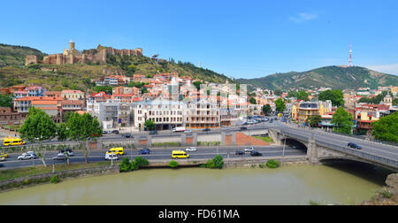 Houses, bridge, river and Narikala fortress on the hill in the downtown of Tbilisi. Georgia Stock Photo