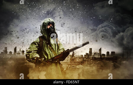 Image of stalker with gun. Ecology catastrophe Stock Photo