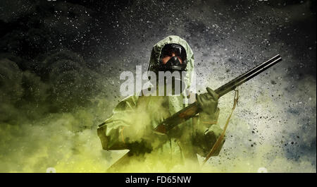 Image of stalker with gun. Ecology catastrophe Stock Photo