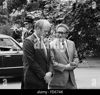 Gerald Ford and Henry Kissinger. President Gerald Ford and Secretary of State Dr Henry Kissinger on the grounds of the White House, Washington DC, August 1974 Stock Photo