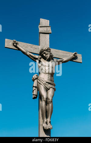 The statue of crucified Christ on cross on Lazebnicky most bridge in Cesky Krumlov, Czech republic. Stock Photo