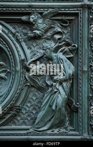 Saint Mark the Evangelist. Detail of the main bronze door of the Milan Cathedral (Duomo di Milano) in Milan, Italy. The bronze door was designed by Italian sculptor Ludovico Pogliaghi in 1894-1908.