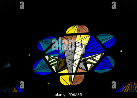 A stained glass window in tthe Almudena cathedral with the form of a hexagone Stock Photo