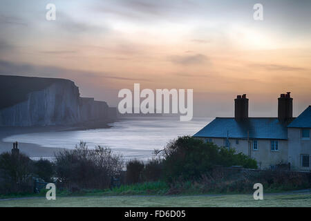 Stunning foggy Winter sunrise Seven Sisters cliffs landscape in England Stock Photo