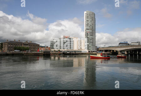 View across the River Lagan Belfast at Lagan Weir (l-r) Customs House, Royal Mail (Tomb Stree) and The Obel. Stock Photo