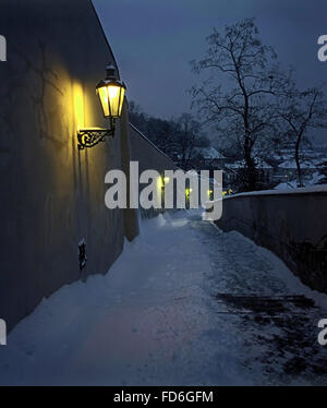 Night winter view on staircase leading to the Prague castle, covered by snow. Czech republic Stock Photo