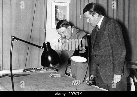 Albert Speer and Adolf Hitler examine blueprints, 1937 Stock Photo