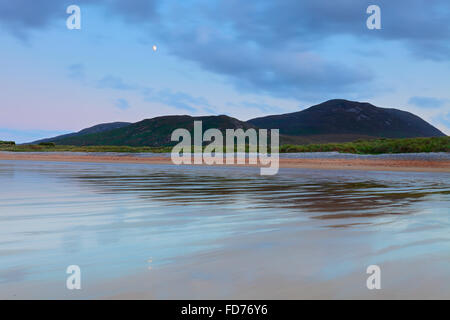 moon over the Beach of the Tullagh Bay on peninsula Inishowen, Donegal; Tullagh Strand Ballyliffin Co Donegal Stock Photo