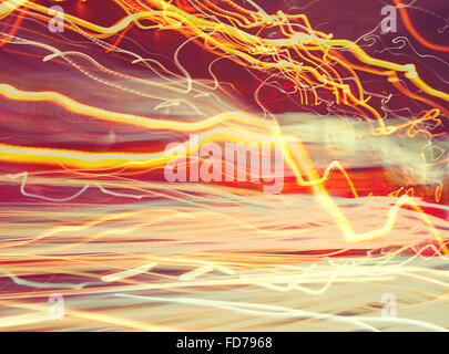 Abstract glowing background, blurry car lights, long exposure, traffic on the road, slow motion, creative wallpaper Stock Photo
