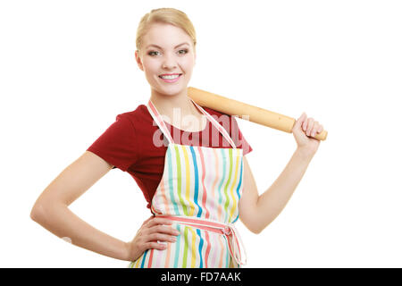Happy housewife or baker chef wearing kitchen apron holds baking rolling pin studio picture isolated on white Stock Photo