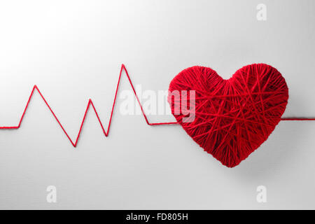 Red heart made from wool isolated on white background Stock Photo - Alamy