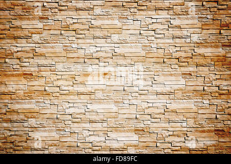 Pattern from lite brown decorative slate stone wall surface. For use as background. Stock Photo