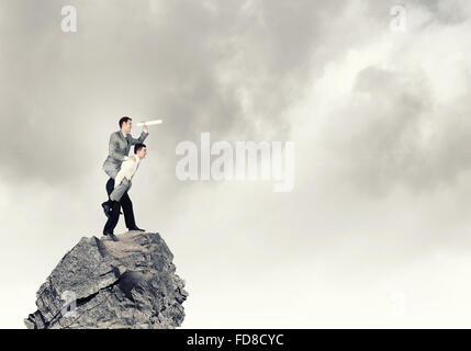 Businessman riding on back of his colleague Stock Photo