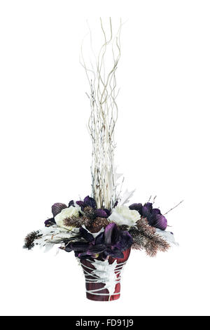 Arrangement from artificial flowers orchids, roses, Christmas balls and maple leaves in vase isolated on white background. Stock Photo