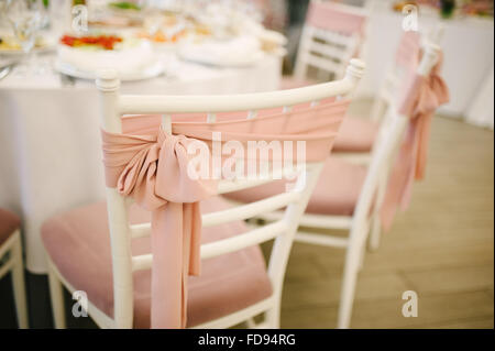 Banquet wedding chairs setting on evening reception awaiting guests Stock Photo