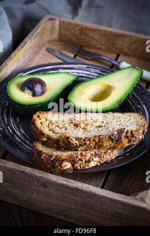 Avocado and whole grain bread Stock Photo